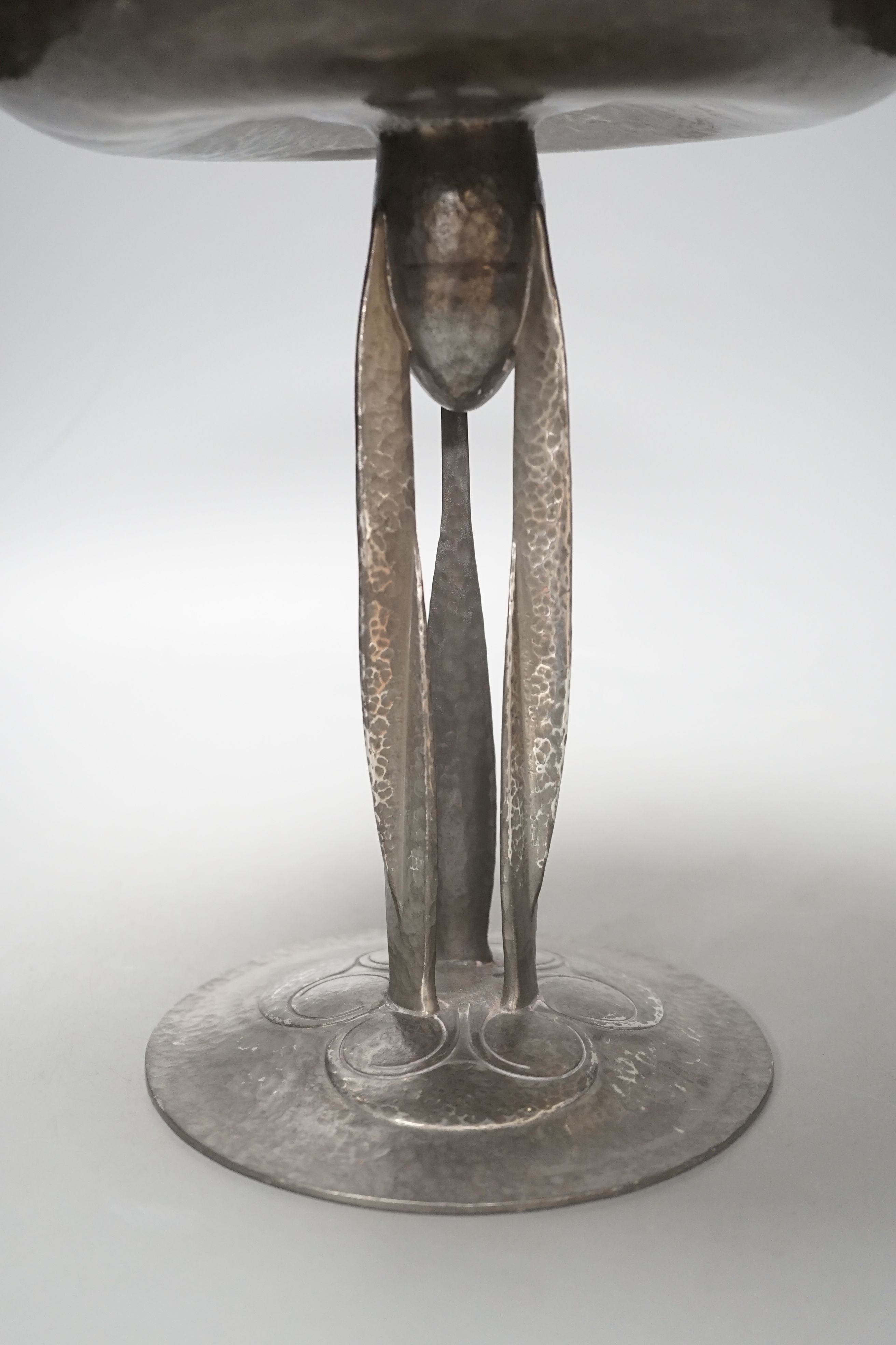 A Liberty's Tudric tazza, designed by Archibald Knox, stamped English pewter 01161, 25 cms high.